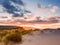 Beautiful sunset over Burren and Atlantic ocean, Cloudy sky, Sand dunes. West coast of Ireland