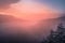 Beautiful sunset over a foggy mountainous landscape