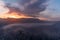 Beautiful sunset over a foggy mountainous landscape