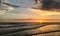 A beautiful sunset over the Gulf of Mexico is viewed from the beach at Treasure Island, Florida