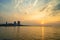 Beautiful sunset over the ocean at Sriracha town in Chonburi, Thailand showing colorful sky and dramatic clouds