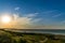 Beautiful sunset over the sea shore. clear summer evening with a little cloud in the sky