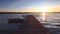 Beautiful Sunset Over Wooden Jetty and sea lake