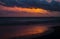 Beautiful sunset at Paradise island Sri Lanka, Bright vivid orange skyline, and the reflection on the beach waves creating perfect