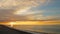 Beautiful sunset on pebble beach of Black Sea, waves washing seashore, nature