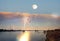 Beautiful  sunset reflection on sea water cloudy starry sky and moon seascape nature landscape