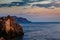 Beautiful sunset, rocks and sea in the evening