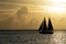 Beautiful sunset with sailboat silhouette