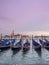 Beautiful sunset from San Marco square, Venice, Italy, overlooking the gondolas and the church of San Giorgio Maggiore