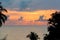 Beautiful sunset on the sea with silhouette trees. Morning sunrise on the beach of Desaru Coast, Malaysia