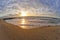 Beautiful sunset at the sea, strip of breakwaters and stones