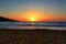 Beautiful sunset on a secluded Mediterranean sandy beach