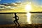 Beautiful sunset and silhouette of child at Hickam Beach, Hawaii