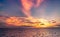 Beautiful sunset sky. Beach sunset. Twilight sea and sky. Tropical sea at dusk. Dramatic orange and blue sky. Calm sea. Sunset