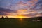 Beautiful sunset sky over farmland