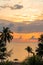 Beautiful sunset sky on the sea with silhouette trees. Morning sunrise on the beach of Desaru Coast, Malaysia