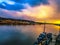 Beautiful sunset and skyline reflecting off a lake.