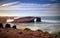 Beautiful sunset and stone arches on Playa de las Catedrales, Spain