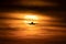Beautiful sunset with sun behind airplane