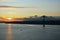 Beautiful sunset. Tejo river. 25th April bridge. Lisbon. Portugal. Almada. Clouds. Yacht. Boat. Sun. Colourfully. Light. Sunlight.