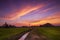 Beautiful sunset twilight sky with river cannel at the rice farm field with mountain background landscape