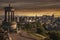 Beautiful sunset view from Calton Hill in Edinburgh, Scotland with monument and historical buildings in the city