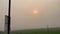 Beautiful sunset view from a moving vehicle. Nature footage with green fields and sky at dusk time. Rural area video from a moving