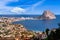 Beautiful super wide-angle aerial view of Calpe, Calp, Spain with harbor and skyline, Penon de Ifach mountain, beach and scenery