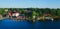 Beautiful super wide-angle aerial view of Stockholm archipelago skerries and suburbs with classic sweden scandinavian designed cot