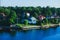 Beautiful super wide-angle aerial view of Stockholm archipelago skerries and suburbs with classic sweden scandinavian designed cot