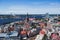 Beautiful super wide-angle panoramic aerial view of Riga, Latvia with harbor and skyline with scenery beyond the city