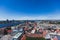 Beautiful super wide-angle panoramic aerial view of Riga, Latvia with harbor and skyline with scenery beyond the city