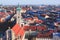 Beautiful super wide-angle sunny aerial view of Munich, Bayern, Bavaria, Germany with skyline and scenery beyond the city, seen fr