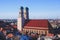 Beautiful super wide-angle sunny aerial view of Munich, Bayern, Bavaria, Germany with skyline and scenery beyond the city, seen fr