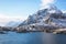 Beautiful super wide-angle winter snowy view of fishing village A, Norway, Lofoten Islands, with skyline, mountains, famous fishin