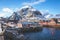 Beautiful super wide-angle winter snowy view of fishing village A, Norway, Lofoten Islands, with skyline, mountains, famous fishin