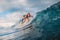 Beautiful surfer girl on surfboard. Woman in ocean during surfing. Surfer and barrel wave