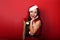 Beautiful surprising woman with open mouth in Santa Claus Christ