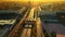 A beautiful surreal aerial flight over the city and highway bridge at sunrise on a summer morning.