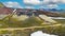 Beautiful surreal icelandic natur landscape, colorful volcano crater, blue summer sky fluffy white clouds - Iceland, Kerid