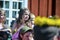 Beautiful swedish people and dissapointed kids are enjoying traditional decoration of mid summer day wearing colourful crown in