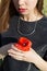 Beautiful sweet girl with big lips plump with poppy in hand walking in a field on a sunny day at sunset