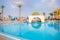 Beautiful swimming pool with a bar in the oriental style. The recreation area is in a luxurious five-star hotel. The concept of