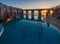 Beautiful swimming pool with thermal watere on the sunset