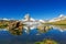 Beautiful Swiss Alps landscape with lake and mountains reflection in water