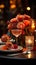 A beautiful table arrangement featuring wine glasses, candles, and a radiant rose