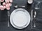 Beautiful table setting on gray linen tablecloth