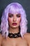 Beautiful tanned woman with lilac hair and bright fancy makeup