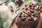 Beautiful tasty dried mixed nut Christmas fruit cake on wooden table