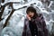 Beautiful teacher, student with glasses, fur coat in winter forest